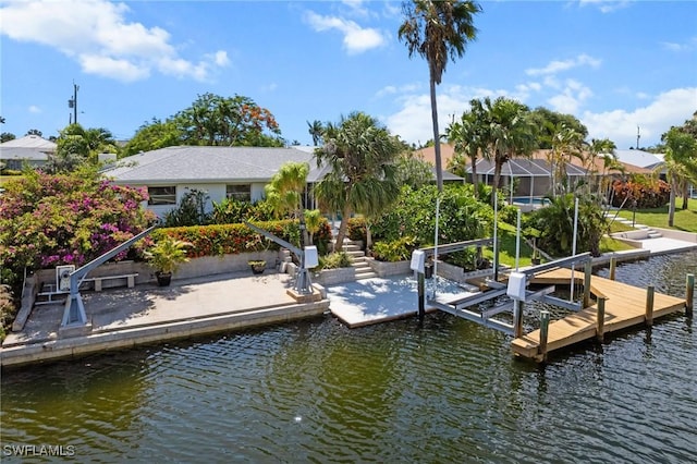 5301 SW 8th Pl, Cape Coral, FL 33914 - dock area featuring boat lift and a water view