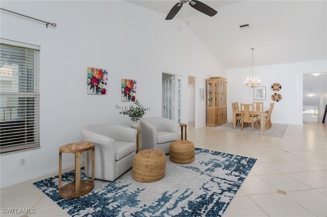 2525 Aspen Creek Ln Unit 202, Naples, FL 34119 - sitting room with tile patterned floors, a ceiling fan, high vaulted ceiling, and a chandelier