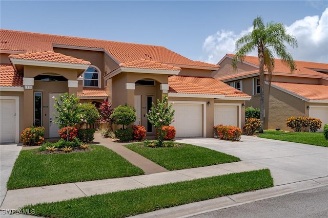 2525 Aspen Creek Ln Unit 202, Naples, FL 34119 - mediterranean / spanish-style house featuring a tiled roof, a garage, driveway, and stucco siding