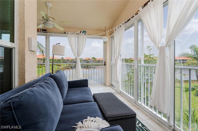 2525 Aspen Creek Ln Unit 202, Naples, FL 34119 - sunroom / solarium with tile patterned flooring, a water view, ceiling fan, and vaulted ceiling