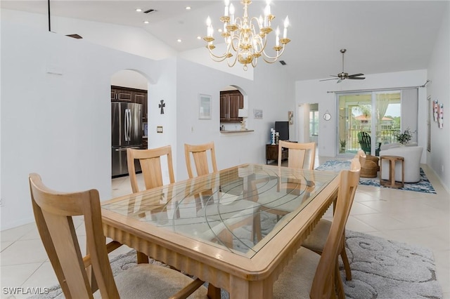 2525 Aspen Creek Ln Unit 202, Naples, FL 34119 - dining area with vaulted ceiling, arched walkways, light tile patterned flooring, a ceiling fan, and a chandelier