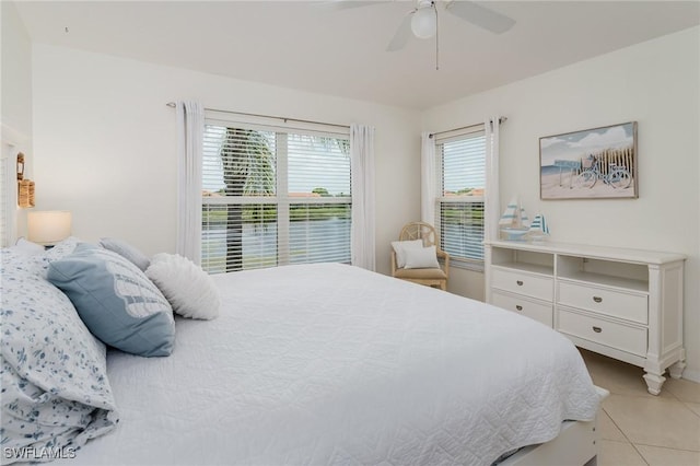 2525 Aspen Creek Ln Unit 202, Naples, FL 34119 - bedroom with light tile patterned floors and a ceiling fan