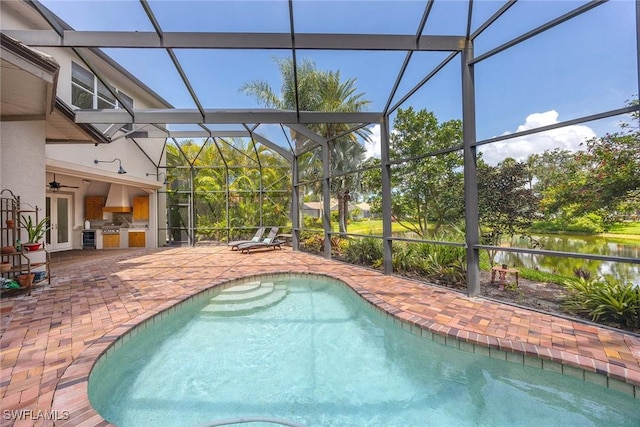 6912 Anthurium Ln, Naples, FL 34113 - swimming pool featuring area for grilling, a patio area, a water view, and glass enclosure