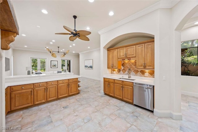 6912 Anthurium Ln, Naples, FL 34113 - kitchen featuring stainless steel dishwasher, ornamental molding, light countertops, plenty of natural light, and recessed lighting