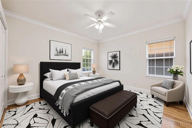 6912 Anthurium Ln, Naples, FL 34113 - bedroom with ornamental molding, light wood-style floors, and a ceiling fan