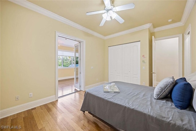 6912 Anthurium Ln, Naples, FL 34113 - bedroom with wood finished floors, ornamental molding, a closet, and a ceiling fan