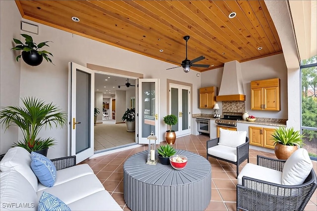 6912 Anthurium Ln, Naples, FL 34113 - view of patio / terrace with outdoor lounge area, french doors, exterior kitchen, and ceiling fan