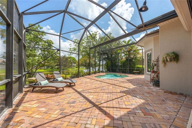 6912 Anthurium Ln, Naples, FL 34113 - view of patio / terrace featuring a hot tub and a lanai