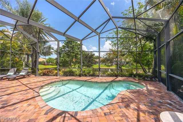 6912 Anthurium Ln, Naples, FL 34113 - outdoor pool with a patio and a lanai