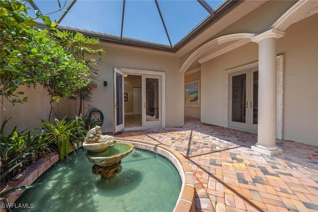 6912 Anthurium Ln, Naples, FL 34113 - exterior space featuring french doors, a patio, and a lanai