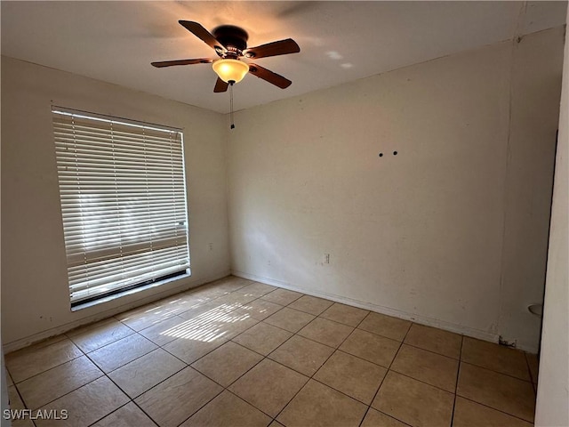 1224 Commonwealth Cir Unit N-203, Naples, FL 34116 - empty room with light tile patterned floors and a ceiling fan