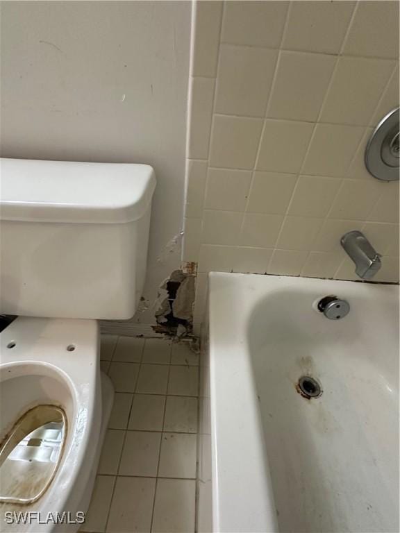 1224 Commonwealth Cir Unit N-203, Naples, FL 34116 - bathroom featuring tile patterned flooring and a tub
