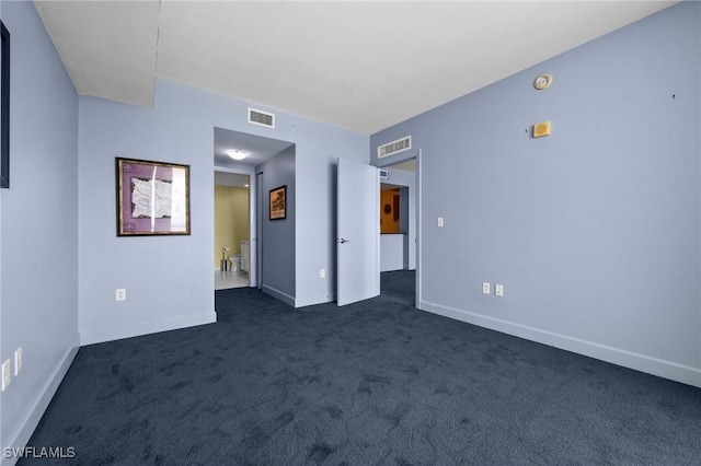 3000 Oasis Grand Blvd Unit 906, Fort Myers, FL 33916 - unfurnished bedroom featuring dark colored carpet and ensuite bathroom