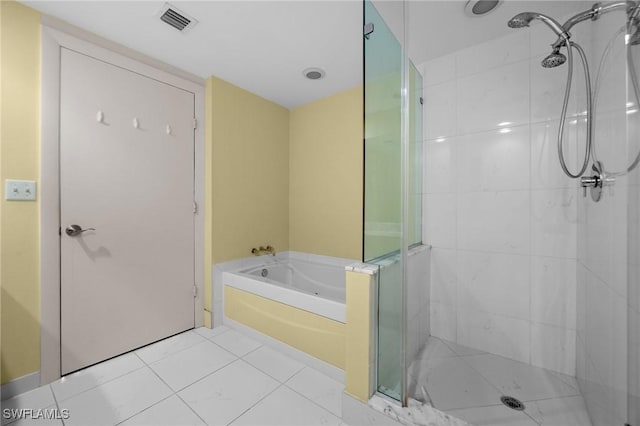 3000 Oasis Grand Blvd Unit 906, Fort Myers, FL 33916 - bathroom featuring a garden tub, a stall shower, and tile patterned flooring