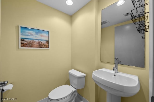 3000 Oasis Grand Blvd Unit 906, Fort Myers, FL 33916 - half bathroom with toilet and recessed lighting