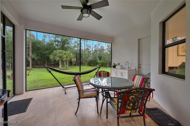4345 6th Ave NE, Naples, FL 34120 - sunroom featuring outdoor dining area and ceiling fan