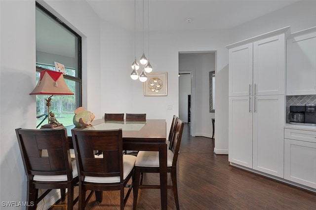 4345 6th Ave NE, Naples, FL 34120 - dining space with dark wood-style floors and a chandelier