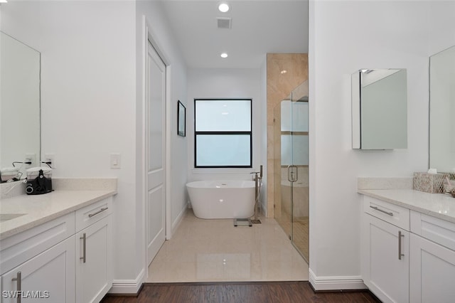 4345 6th Ave NE, Naples, FL 34120 - full bathroom with vanity, a soaking tub, a stall shower, and recessed lighting