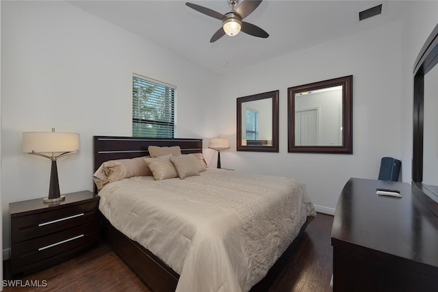 4345 6th Ave NE, Naples, FL 34120 - bedroom with dark wood-type flooring and ceiling fan