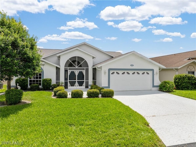 17770 Pineapple Palm Ct, North Fort Myers, FL 33917 - single story home featuring stucco siding, a garage, and a front lawn