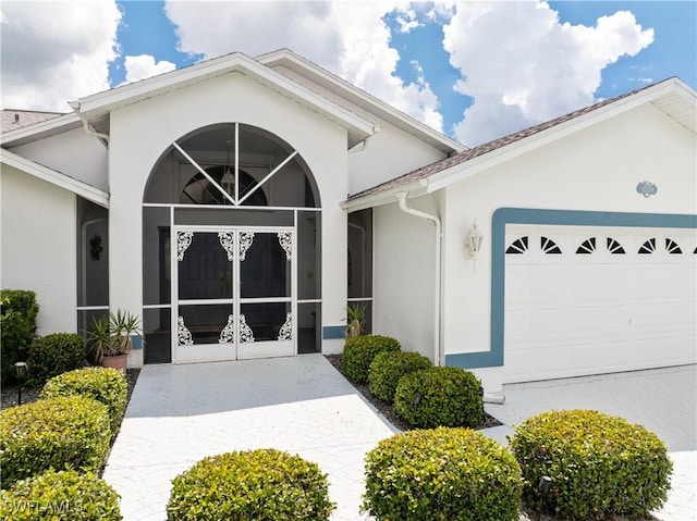17770 Pineapple Palm Ct, North Fort Myers, FL 33917 - view of front of home with stucco siding and a garage