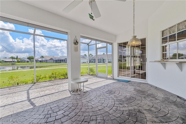 17770 Pineapple Palm Ct, North Fort Myers, FL 33917 - unfurnished sunroom with ceiling fan, a water view, and a residential view