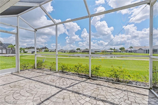 17770 Pineapple Palm Ct, North Fort Myers, FL 33917 - unfurnished sunroom with a residential view, a water view, and lofted ceiling