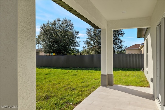3211 8th St W, Lehigh Acres, FL 33971 - fenced backyard featuring a patio area