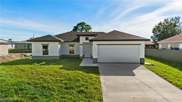 3211 8th St W, Lehigh Acres, FL 33971 - view of front of house with stucco siding, a garage, driveway, and roof with shingles