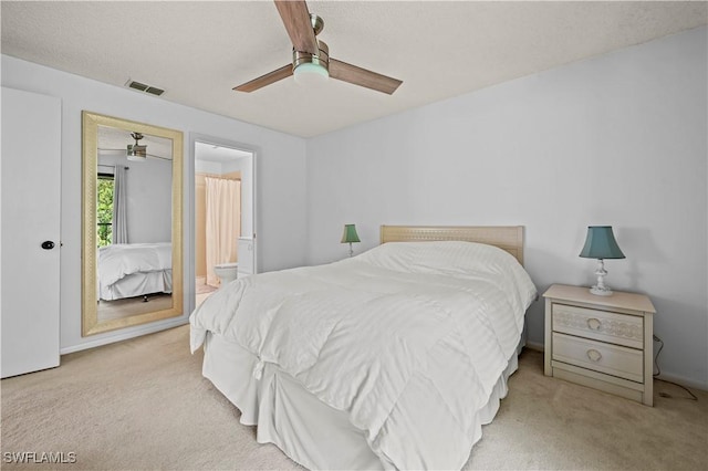240 Pebble Beach Cir Unit F206, Naples, FL 34113 - carpeted bedroom featuring ensuite bath and ceiling fan
