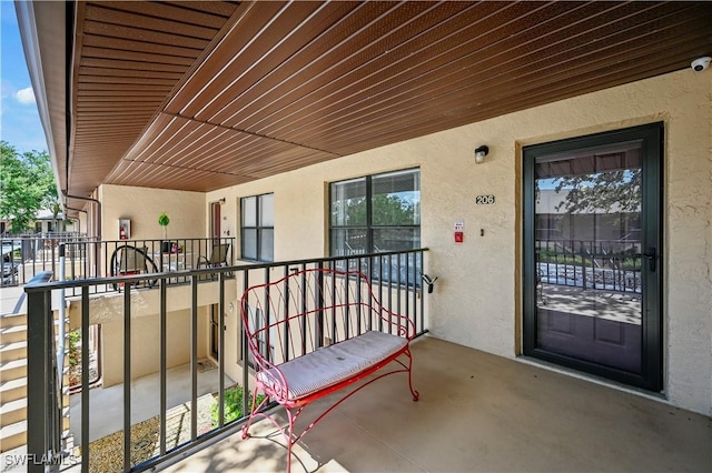 240 Pebble Beach Cir Unit F206, Naples, FL 34113 - doorway to property with stucco siding