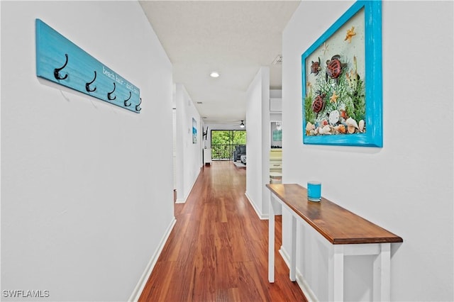 240 Pebble Beach Cir Unit F206, Naples, FL 34113 - hallway featuring wood finished floors and recessed lighting