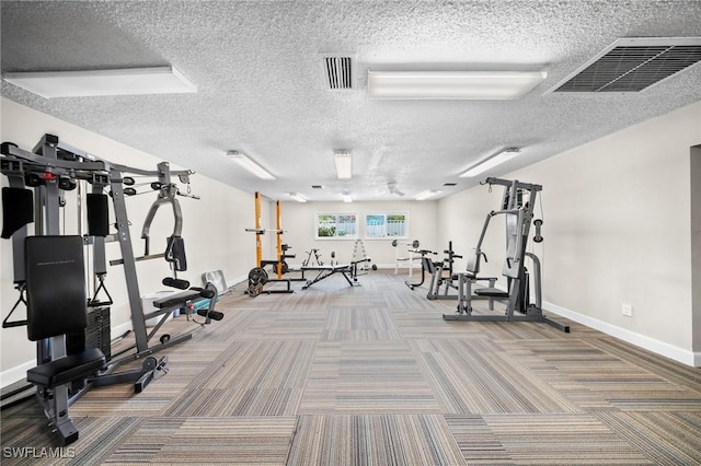 4251 Island Cir Unit 3, Fort Myers, FL 33919 - exercise room featuring carpet floors and a textured ceiling
