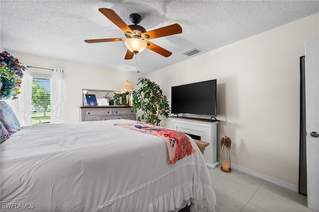 4251 Island Cir Unit 3, Fort Myers, FL 33919 - bedroom with a textured ceiling, ceiling fan, and marble look tile flooring
