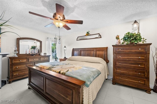 4251 Island Cir Unit 3, Fort Myers, FL 33919 - bedroom with a textured ceiling and ceiling fan