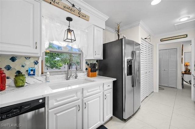 4251 Island Cir Unit 3, Fort Myers, FL 33919 - kitchen with appliances with stainless steel finishes, crown molding, backsplash, and white cabinets