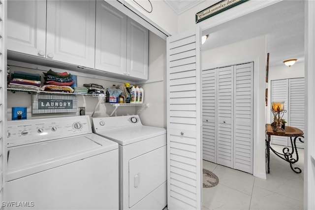 4251 Island Cir Unit 3, Fort Myers, FL 33919 - laundry room with cabinet space, washing machine and dryer, crown molding, and light tile patterned flooring