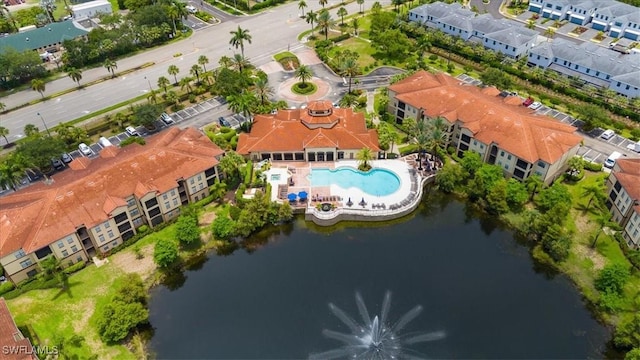 12970 Positano Cir Unit 301, Naples, FL 34105 - drone / aerial view of a pool and a nearby body of water
