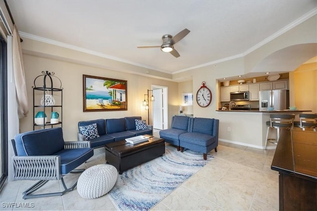 12970 Positano Cir Unit 301, Naples, FL 34105 - living area with ornamental molding, ceiling fan, arched walkways, and light tile patterned floors