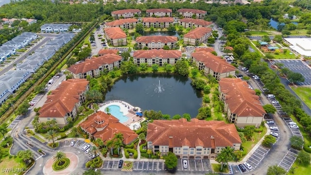 12970 Positano Cir Unit 301, Naples, FL 34105 - bird's eye view of a large body of water and a pool area