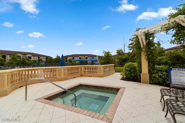 12970 Positano Cir Unit 301, Naples, FL 34105 - view of swimming pool featuring a community hot tub and a patio