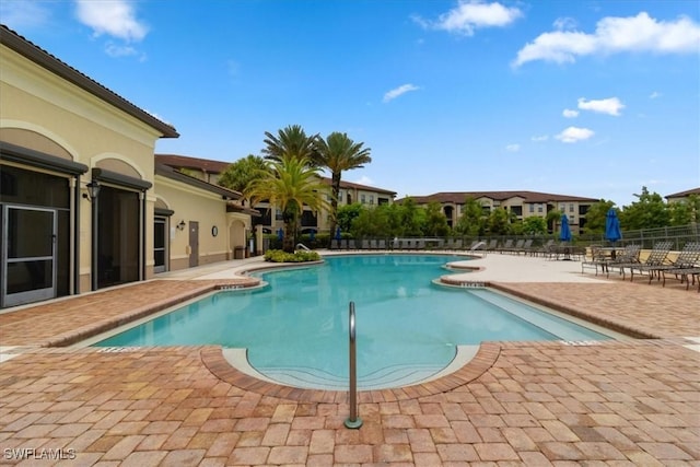 12970 Positano Cir Unit 301, Naples, FL 34105 - community pool featuring a patio area