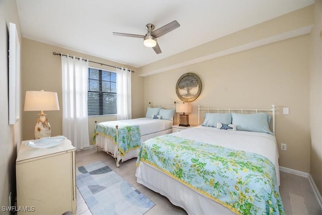 12970 Positano Cir Unit 301, Naples, FL 34105 - bedroom with ceiling fan and baseboards