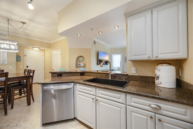 12970 Positano Cir Unit 301, Naples, FL 34105 - kitchen featuring dishwasher, ornamental molding, white cabinetry, dark stone countertops, and pendant lighting