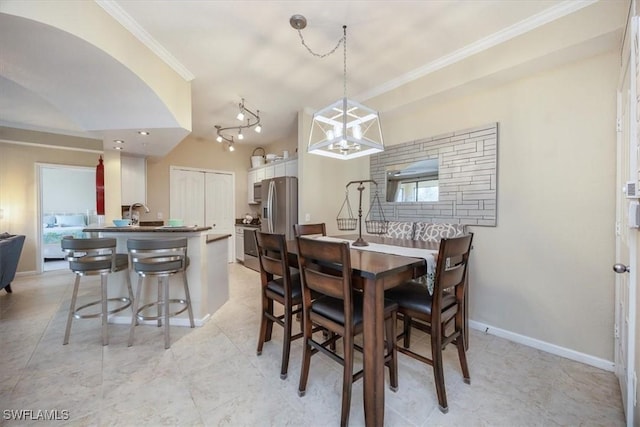 12970 Positano Cir Unit 301, Naples, FL 34105 - dining room featuring baseboards and crown molding
