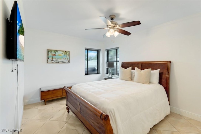 636 98th Ave N, Naples, FL 34108 - bedroom with ceiling fan and light tile patterned floors