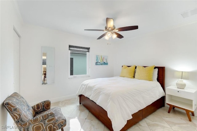 636 98th Ave N, Naples, FL 34108 - tiled bedroom with a ceiling fan and baseboards