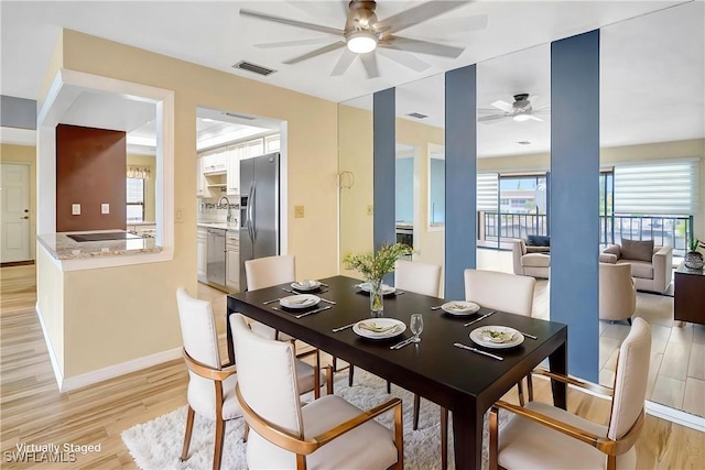 4210 SE 20th Pl Unit C2, Cape Coral, FL 33904 - dining room with ceiling fan and light wood-style floors