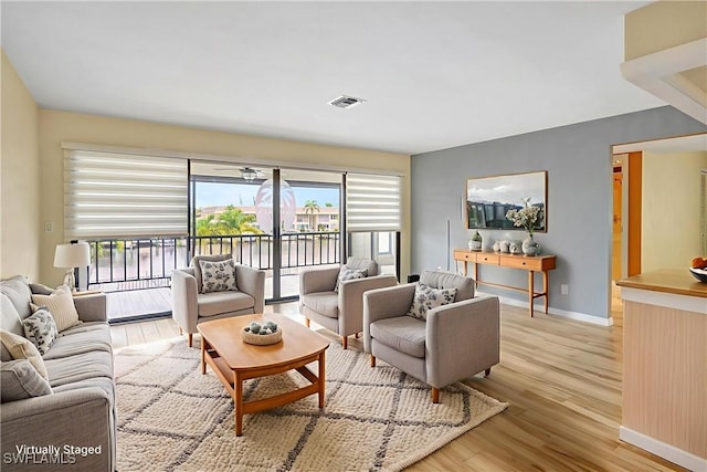 4210 SE 20th Pl Unit C2, Cape Coral, FL 33904 - living area featuring light wood-style floors and baseboards
