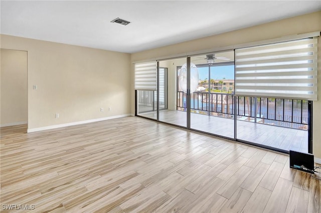 4210 SE 20th Pl Unit C2, Cape Coral, FL 33904 - unfurnished room featuring baseboards and wood finished floors